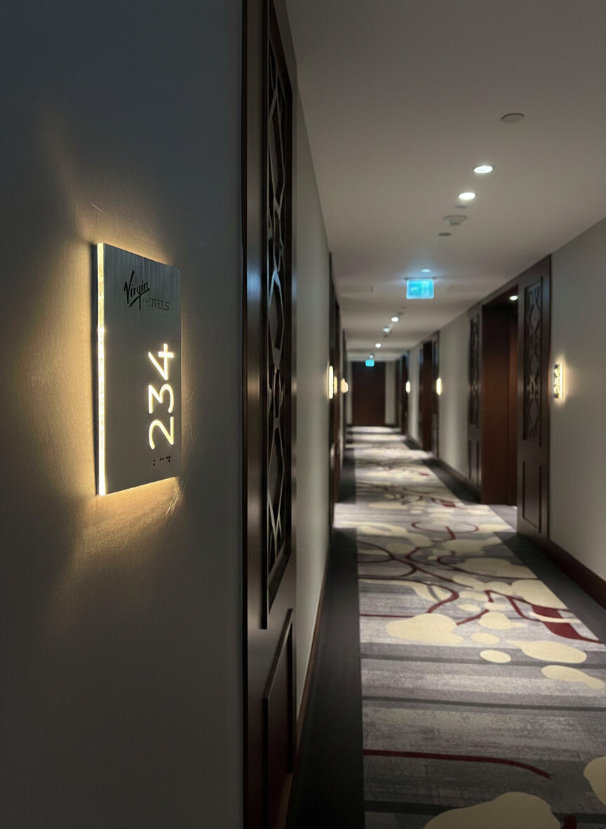 LED hotel room number display with ADA compliant Braille and logo