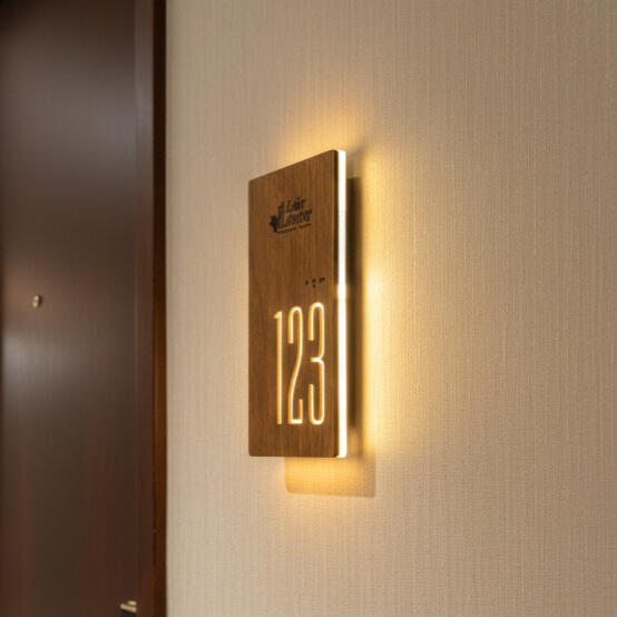 Luxury hotel room number sign with ADA compliant Braille and corporate branding