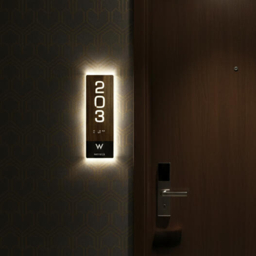 Modern LED hotel room sign with ADA compliant Braille and company logo